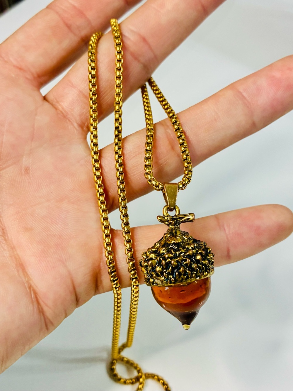 Gold-Tone Glass Acorn Pendant Necklace with Amber-Colored Drop